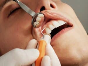 Woman getting dental cleaning at Lytle Family Dentistry